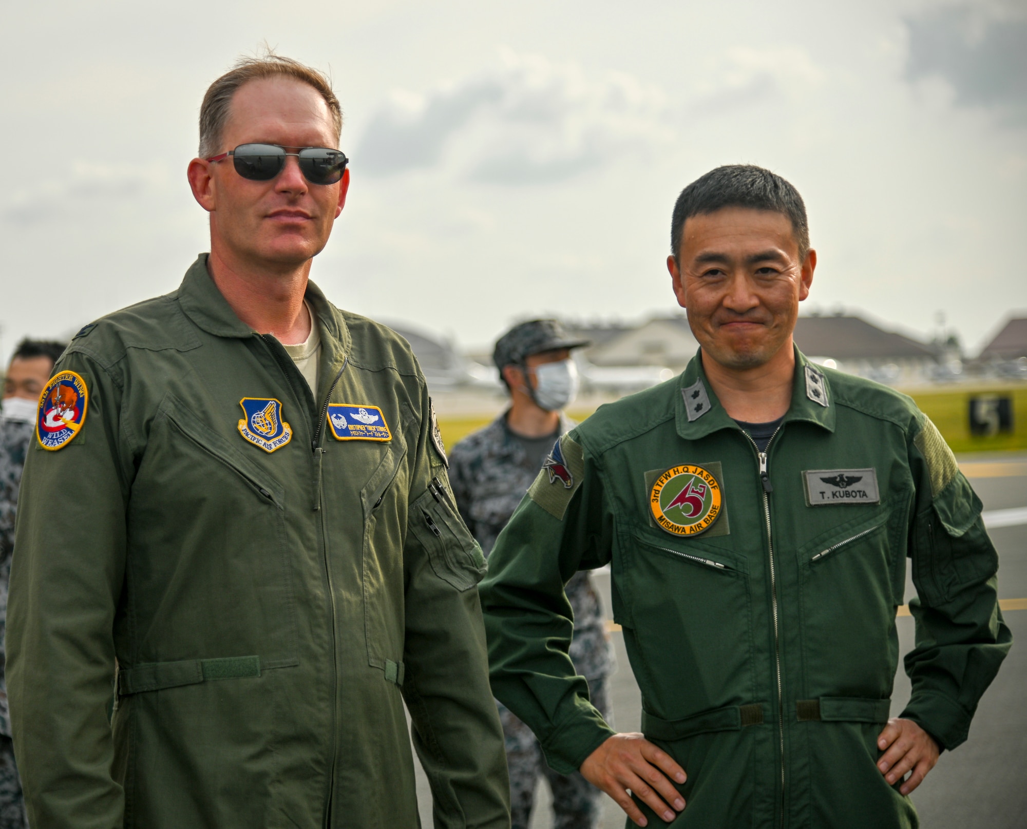 U.S. Air Force Col Kristopher Struve, left, 35th Fighter Wing commander, and Japan Air Self-Defense Force Maj. Gen. Takahiro Kubota, 3rd Air Wing and JASDF Misawa Air Base commander, watch as aircraft taxi into position for an "Elephant Walk" at Misawa Air Base, June 22, 2020. Twelve U.S. Air Force F-16CM Fighting Falcons, 12 Koku-Jieitai F-35A Lightning II Joint Strike Fighters, two U.S. Navy EA-18G Growlers, a USN C-12 Huron, two USAF MC-130J Commando II aircraft, and a USN P-8 Poseidon participated in the Elephant Walk, which showcased Misawa Air Base’s collective readiness and ability to generate combat airpower at a moment's notice to ensure regional stability throughout the Indo-Pacific. This is Misawa Air Base’s first time hosting a bilateral and joint Elephant Walk. (U.S. Air Force photo by Tech. Sgt. Timothy Moore)