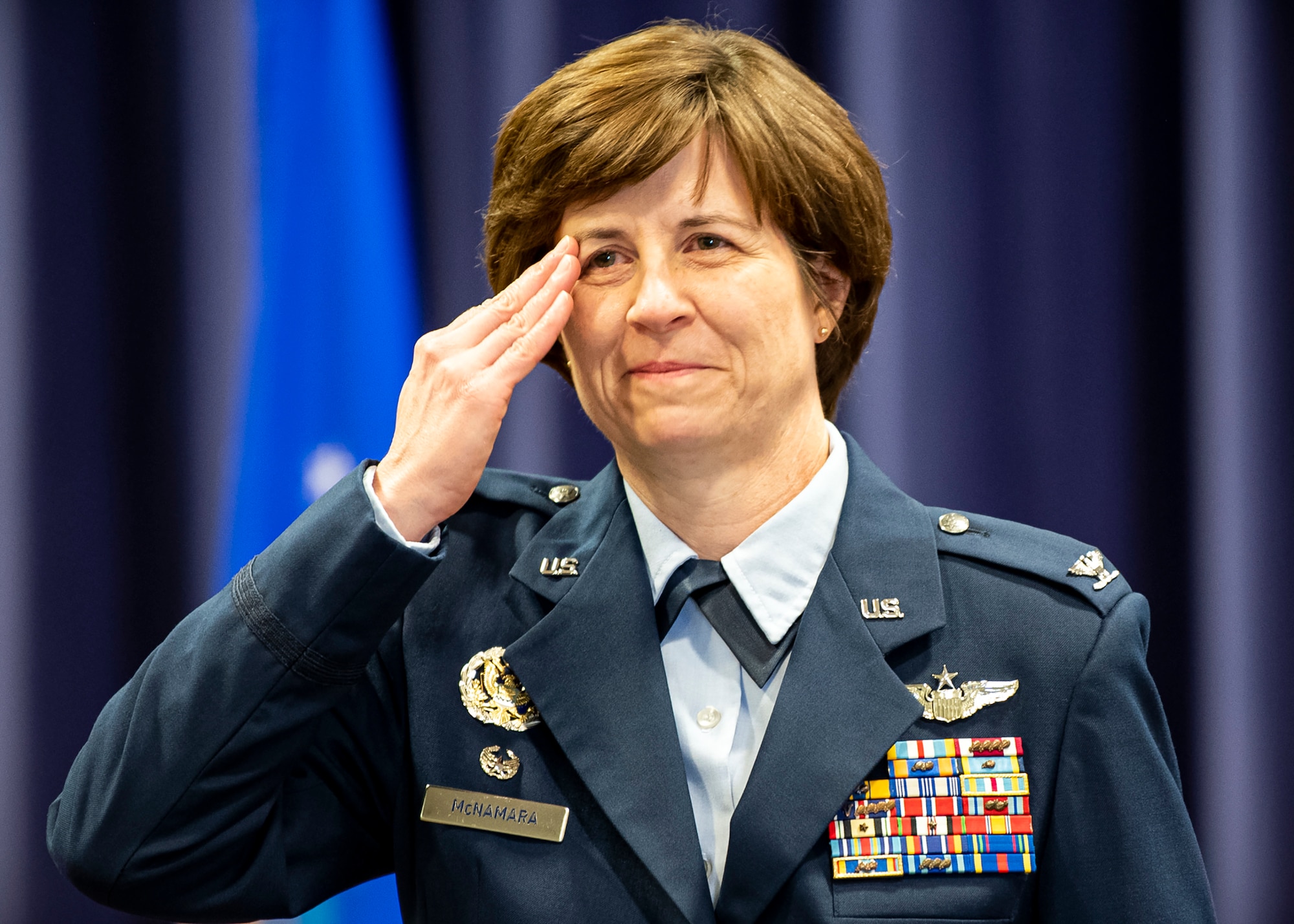 Col. Bridget Mcnamara, outgoing 422d Air Base Group commander, renders a final salute during a change of command ceremony, at RAF Croughton, England, June 22, 2020. During the ceremony, Mcnamara relinquished command of the 422 ABG to Col. Jon Hannah. (U.S. Air Force photo by Senior Airman Eugene Oliver)