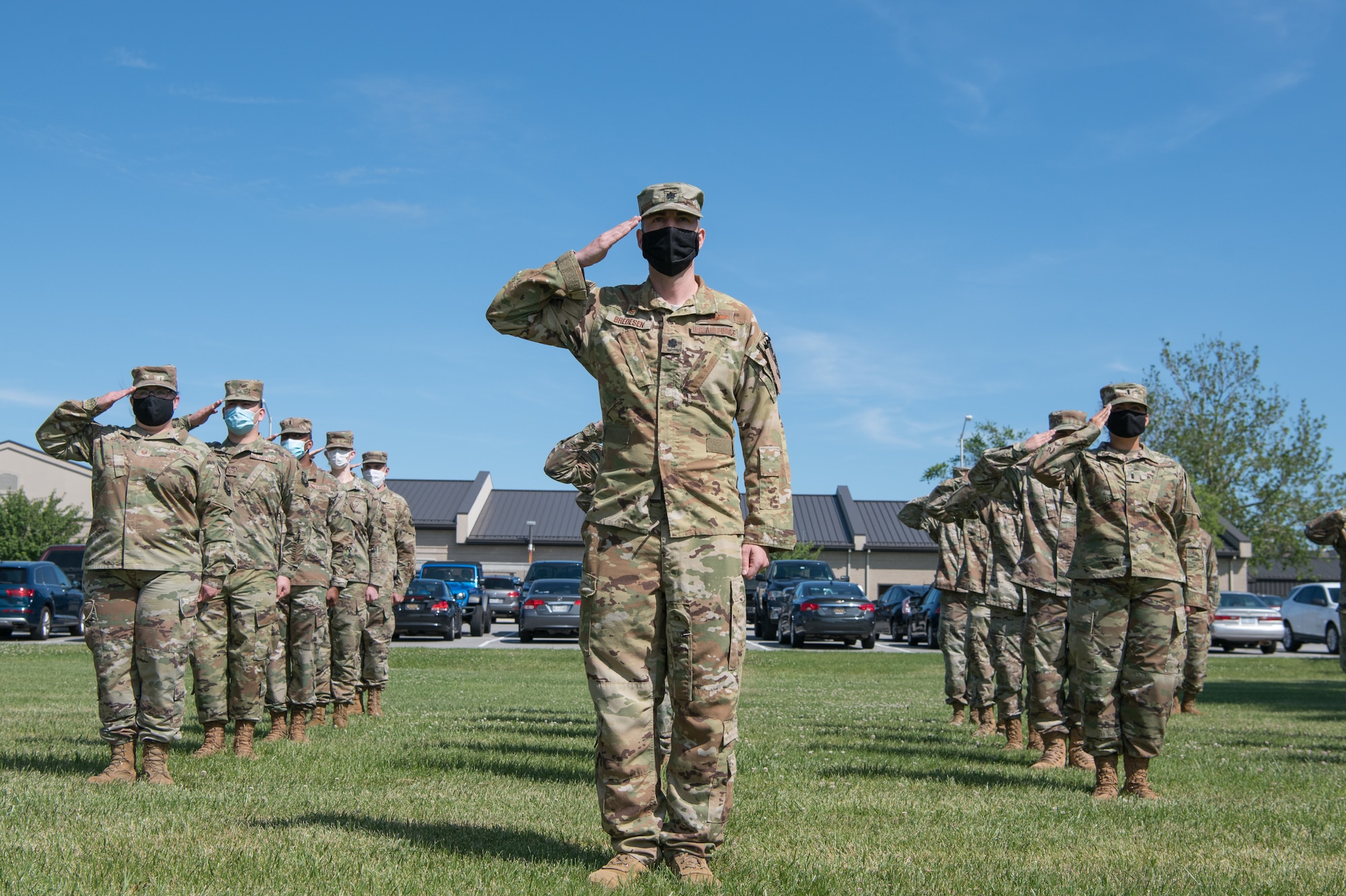 Airmen of the 436th Operations Support Squadron salute during a retreat ceremony June 18, 2020, at Dover Air Force Base, Delaware.
Members of the formation were spaced at least six feet apart and wore masks to help mitigate the potential spread of COVID-19. (U.S. Air Force photo by Mauricio Campino)