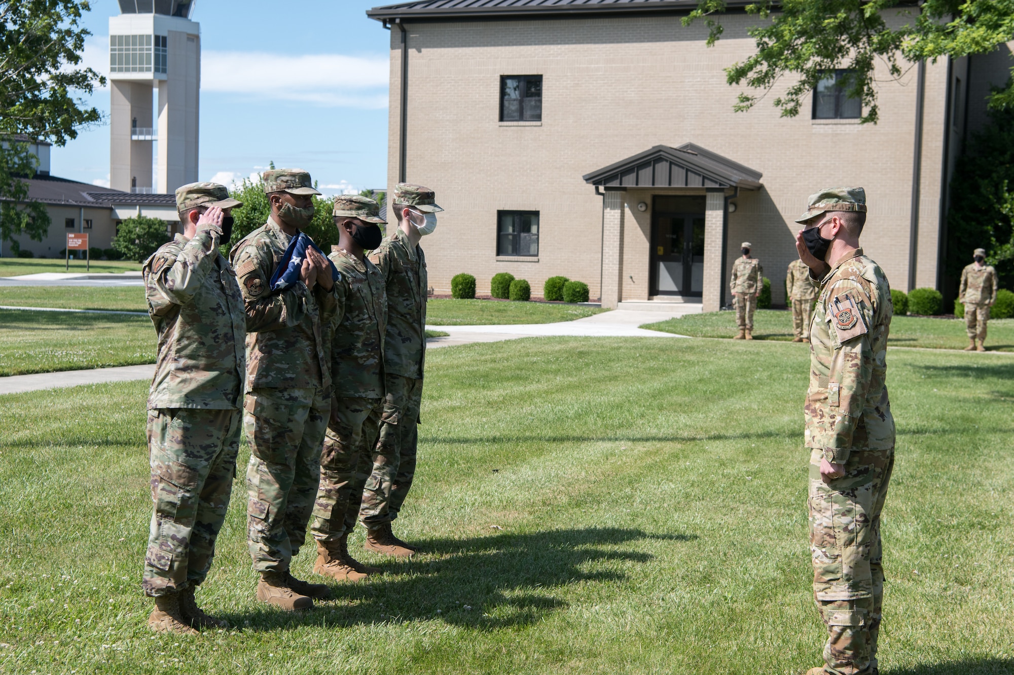 Airmen of the 436th Operations Support Squadron prepare to retire the colors at the conclusion of a retreat ceremony June 18, 2020, at Dover Air Force Base, Delaware. The ceremony is one of the oldest military traditions, dating all the way back to the Revolutionary War. (U.S. Air Force photo by Mauricio Campino)