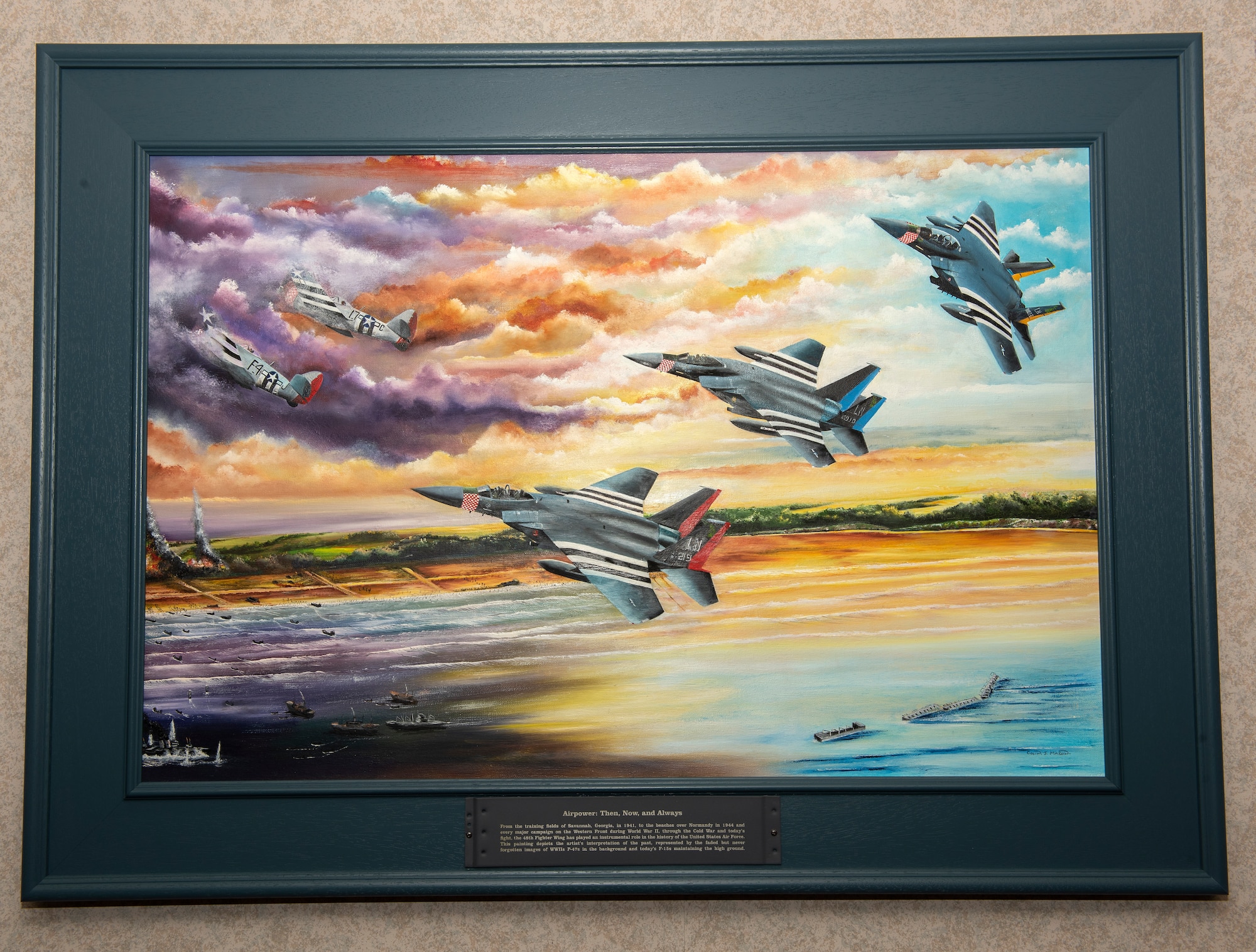 A painting depicting the 48th Fighter Wing heritage F-15s was presented to the wing and Col. William Marshall, 48th FW commander, at Royal Air Force Lakenheath, England, June 19, 2020. The painting is a tribute to 48th FW history and it’s involvement in D-Day at Normandy, France during World War II. (U.S. Air Force photo by Airman 1st Class Jessi Monte)