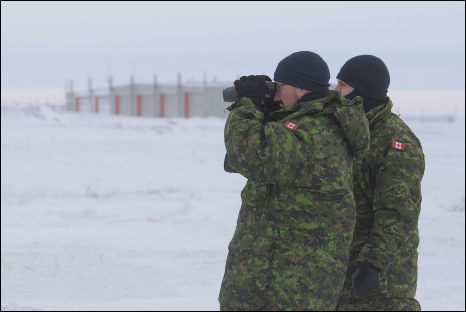 Two members of 2 Air Expeditionary Wing evaluate airfield infrastructure to identify a suitable location for a mobile radar system, during their survey visit to Rankin Inlet on January 29, 2020.