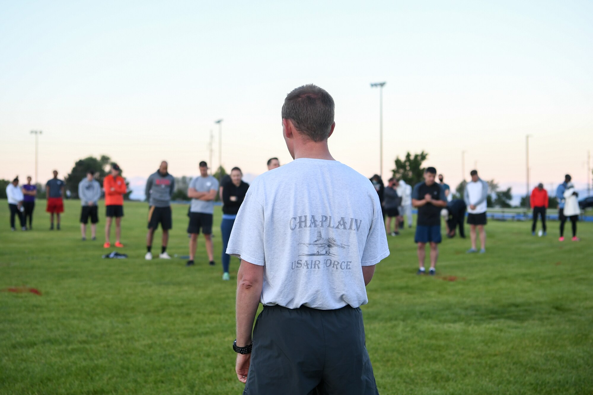 Chaplain (Capt.) Jeffery Larsen, 75th Air Base Wing, gives an invocation before the Unity 5K run/walk.