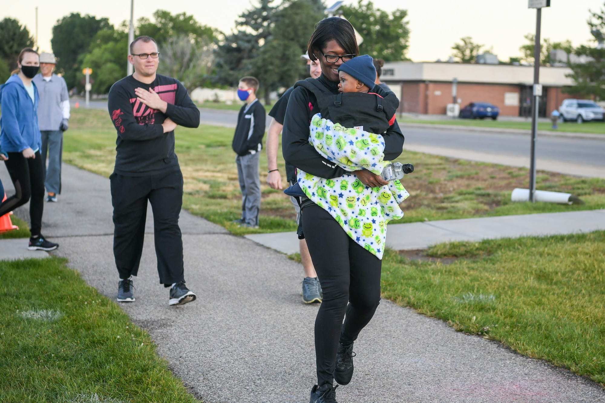 Military and civilian Airmen and their families participate in the Unity 5K run/walk.