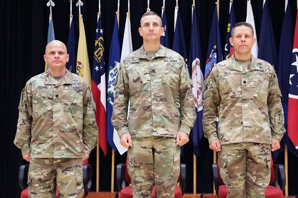 Lt. Col. Marcus D. Perkins, left, new commander of the U.S. Army Medical Materiel Center-Korea, stands with Col. Derek C. Cooper, center, and Lt. Col. Marc R. Welde. Cooper, commander of the 65th Medical Brigade, served as the stand in for Col. Michael Lalor, commander of Army Medical Logistics Command, during a Change of Command ceremony on June 18 at Camp Carroll.