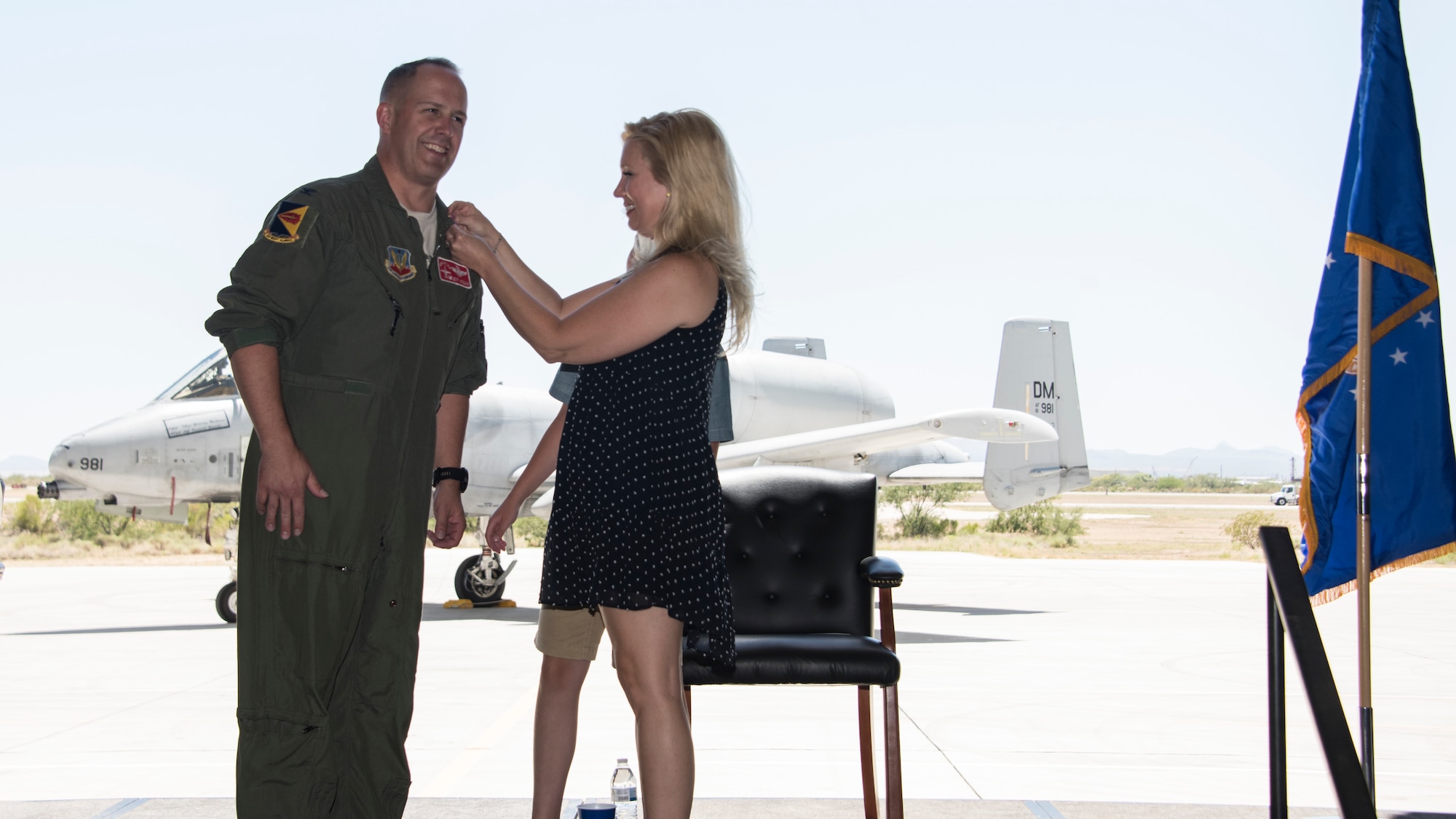 A photo of Col Hogan having his retirement pin pinned on