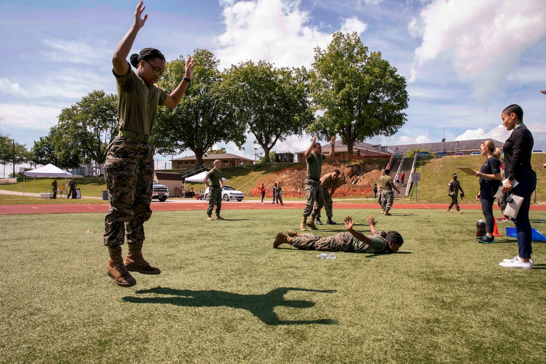 Marines exercise next to each other.