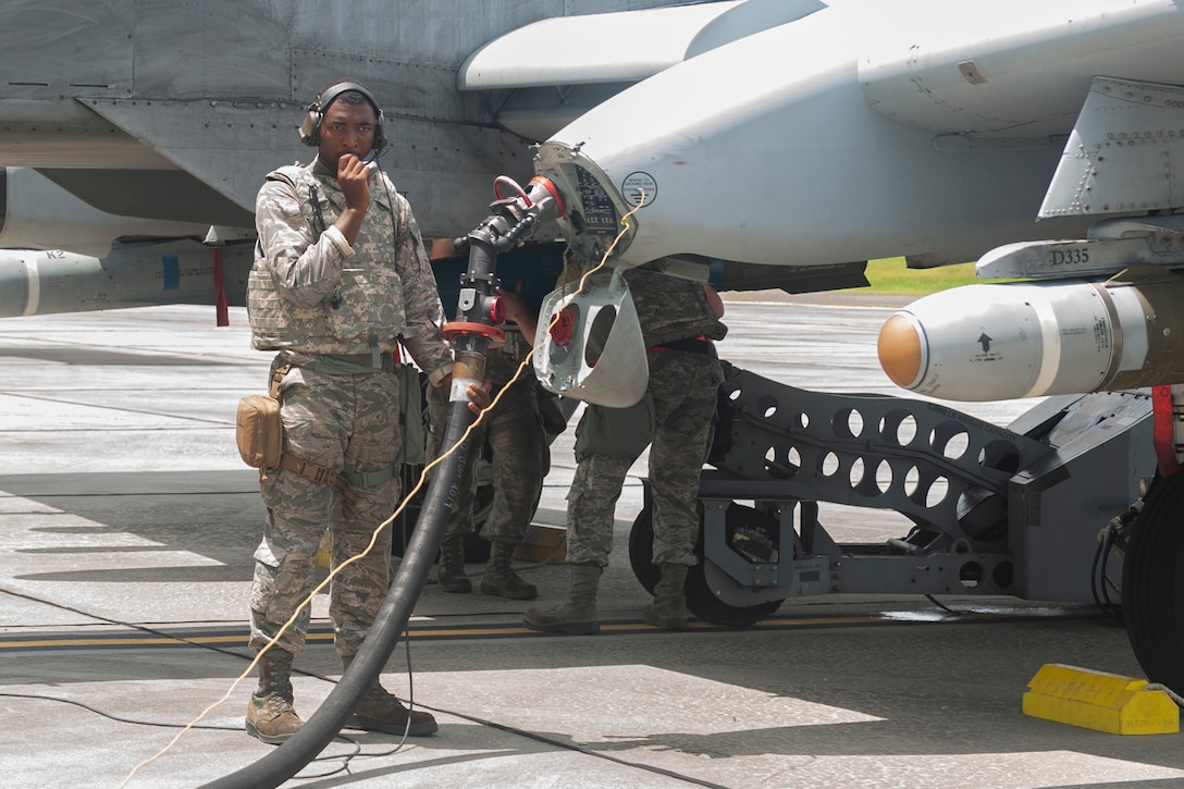 Photo of an Airman fueling an aircraft