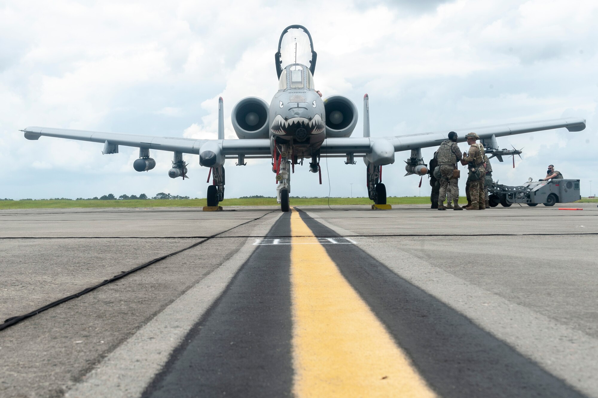 Photo of Airmen preparing to refuel an aircraft