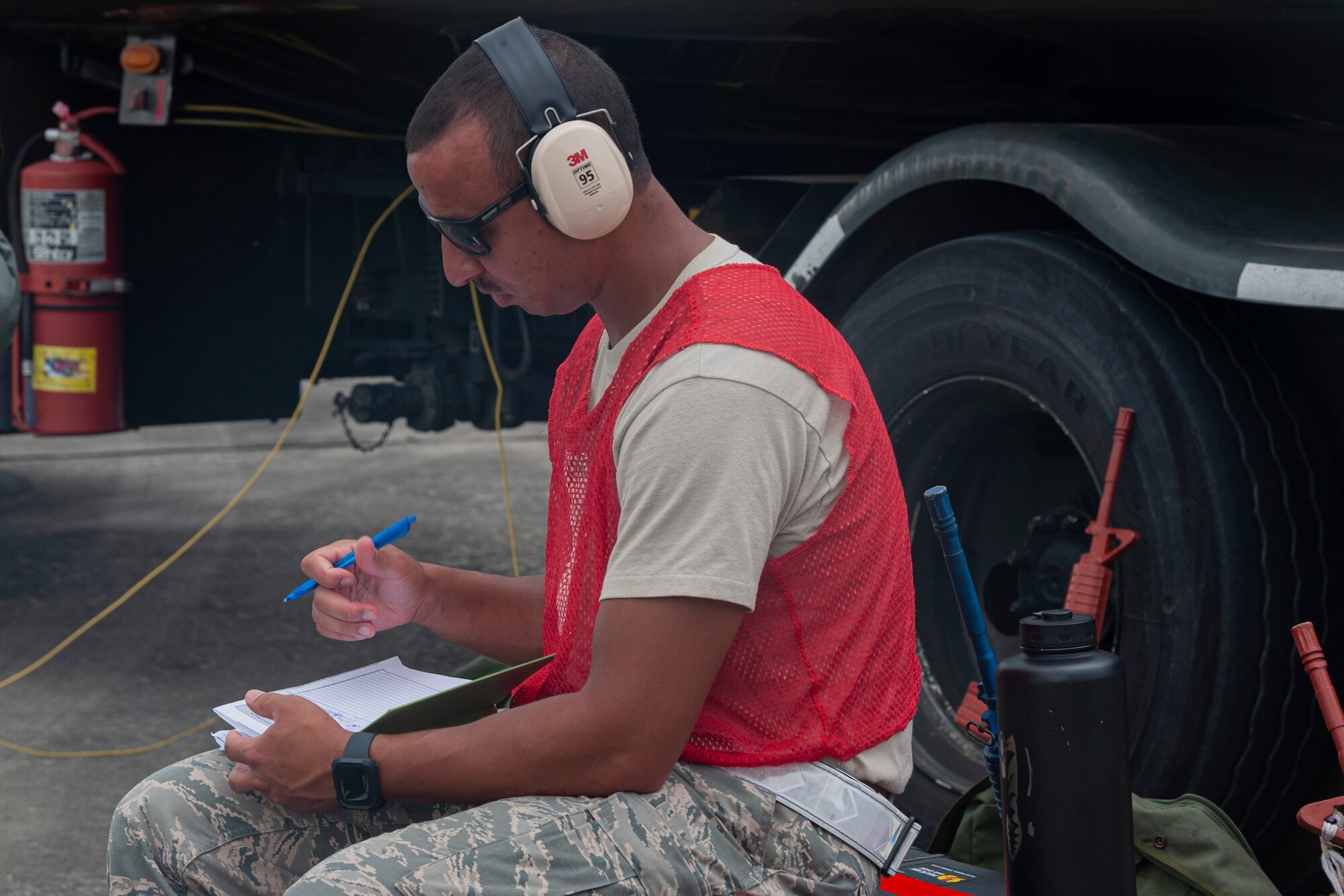 Photo of an Airman taking notes