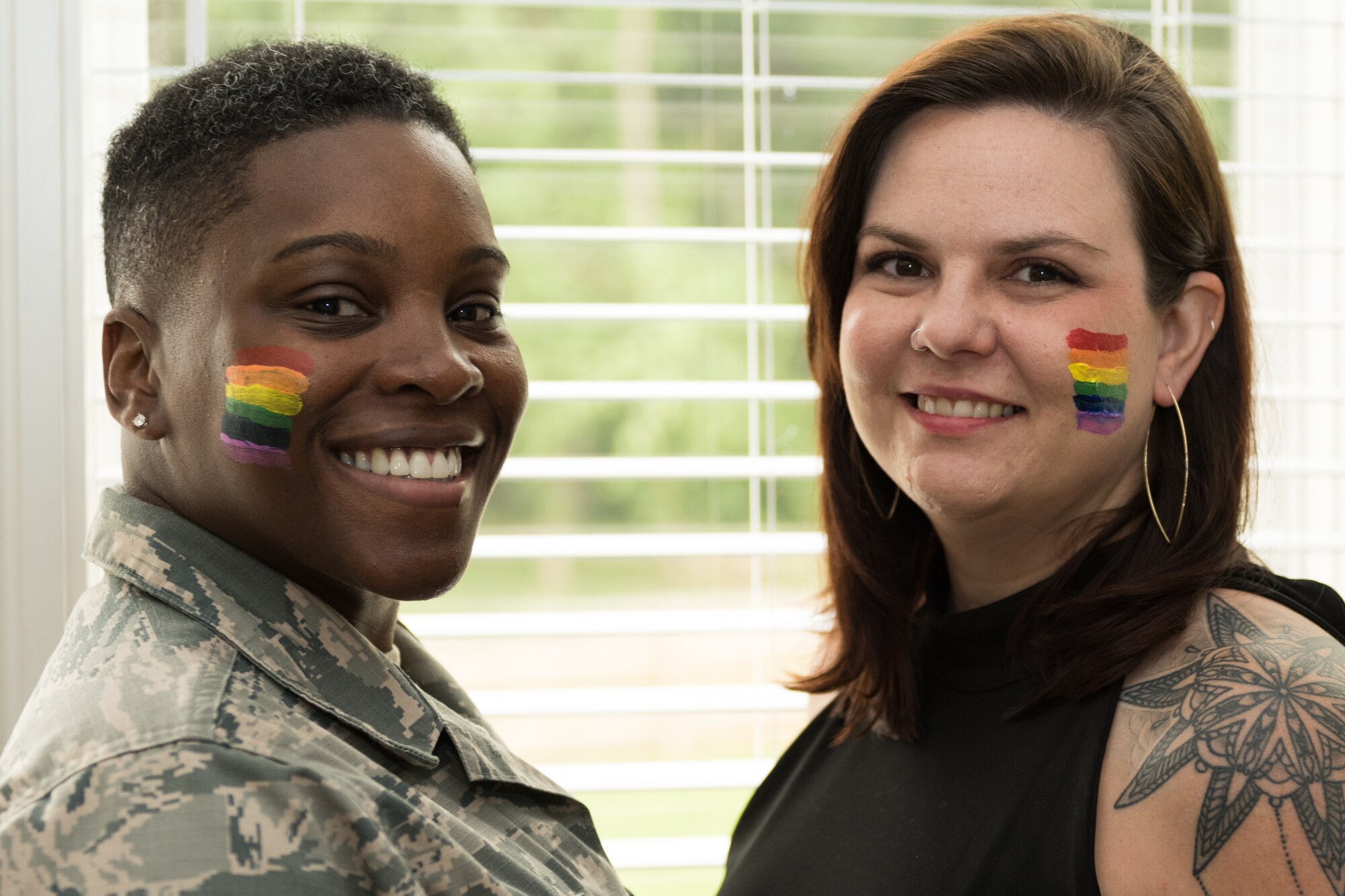 U.S Air Force Master Sgt. Staci Cooper, 131st Operation Support Flight Aviation Resource Management superintendent, and Danie Cooper, Lincoln College Preparatory Academy teacher, stand for a photo on June 10, 2020 at Blue Springs, Missouri. Cooper and her wife married in February 2019 a year after their first date. (U.S Air Force photo by Airman 1st Class Christina Carter)