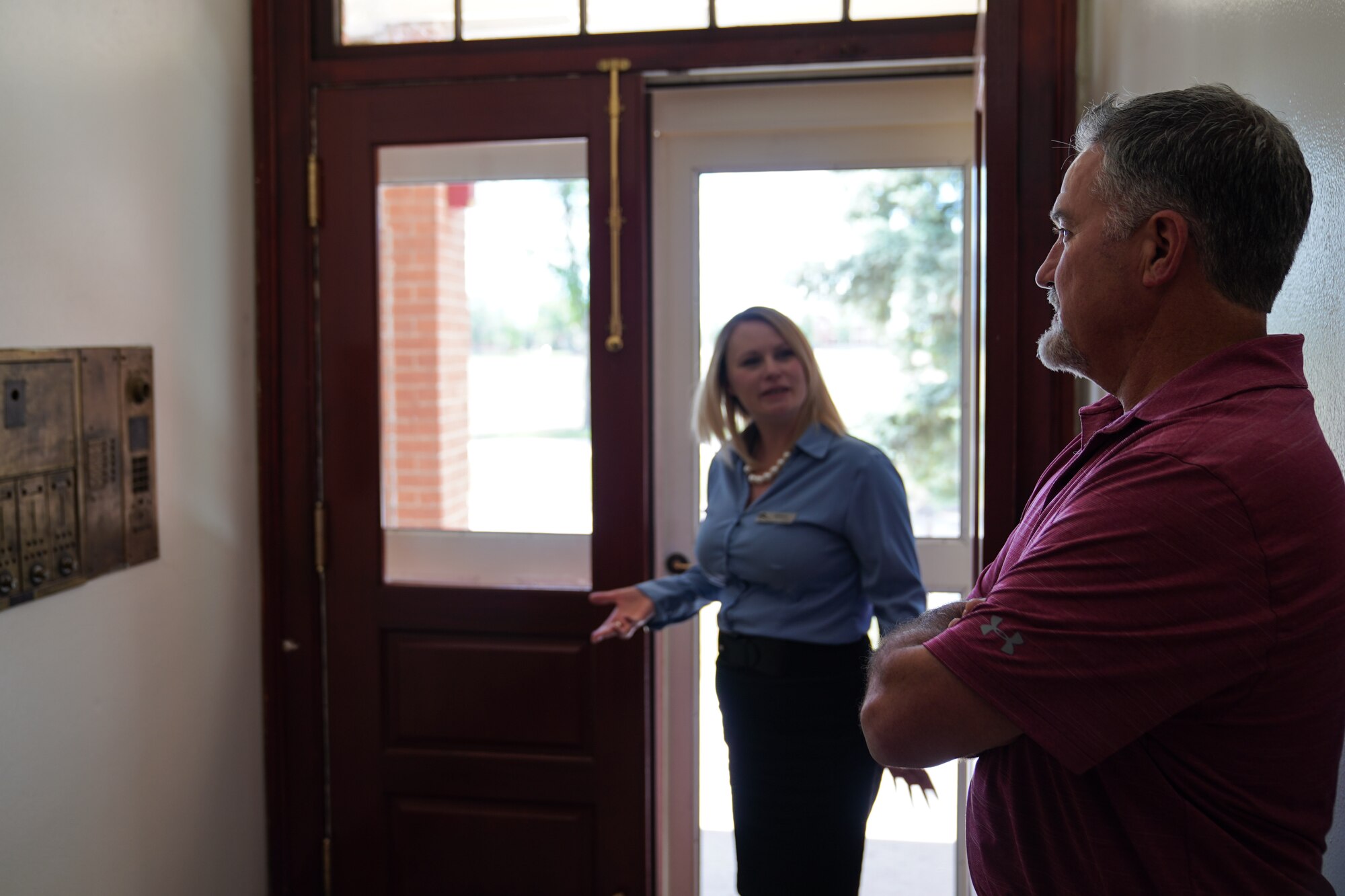 Melissa Jackson, Balfour Beatty Communities community manager, explains the company grade officer history to Thomas Deville, 90th Missile Wing resident advocate, on F.E. Warren Air Force Base, Wyoming, June 10, 2020. Air Force installations created the new resident advocate position to help military families address any housing issues and create culture where military members and their families live in safe, healthy and secure housing. (U.S. Air Force photo by Joseph Coslett)