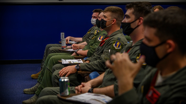 U.S. Air Force, U.S. Navy and Japanese Air Self- Defense Force pilots attend a brief in preparation for an 