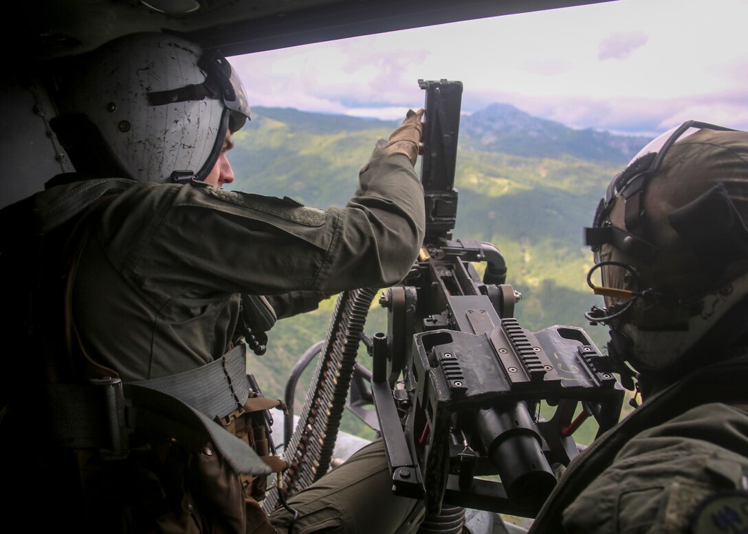 A U.S. Marine reloads an M2 machine gun during routine sustainment training June 22.