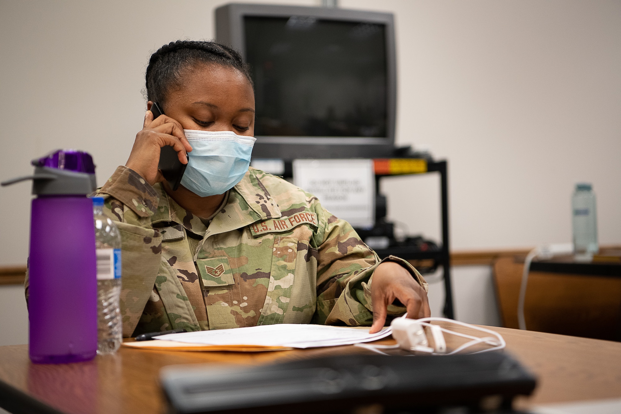 Oklahoma Air National Guard Staff Sgt. Shawntoria Miles, a medic with the 137th Special Operations Medical Group in Oklahoma City, calls an individual as part of contact tracing operations at the the Texas County Health Department in Guymon, Oklahoma, May 15, 2020.