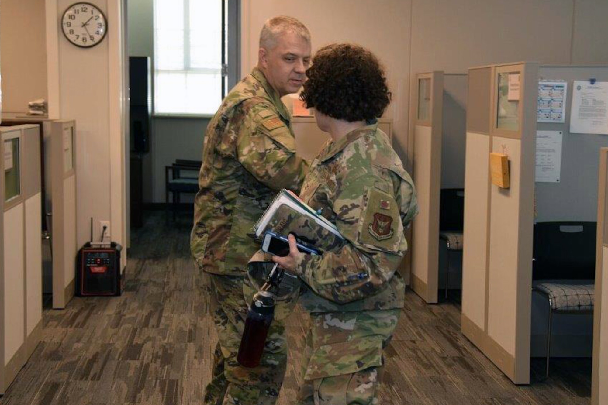 Col. Wayne M. Williams, 433rd Mission Support Group commander, Joint Base San Antonio-Lackland, Texas, greets Col. Lisa M. Craig, Headquarters Air Force Reserve Command A1 director of manpower, personnel and services, Robins Air Force Base, Georgia, for a tour of the 433rd Airlift Wing’s newly renovated buildings here, June 18, 2020.