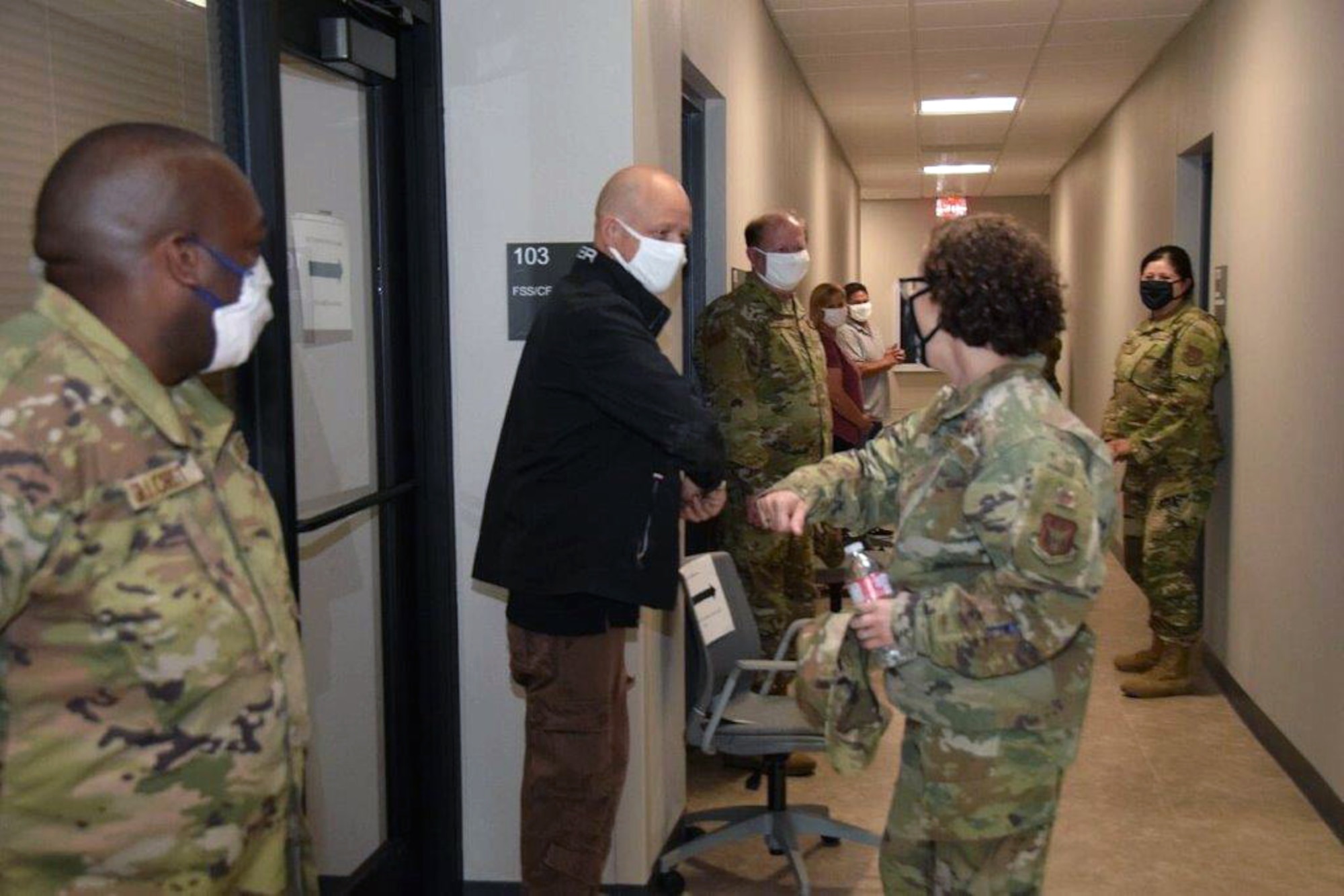 Col. Lisa M. Craig, Headquarters Air Force Reserve Command A1 director of manpower, personnel and services, Robins Air Force Base, Georgia, is greeted by Kenneth Vogel, 433rd Force Support Squadron computer assistant, during a tour of building 817 here on June 18, 2020.