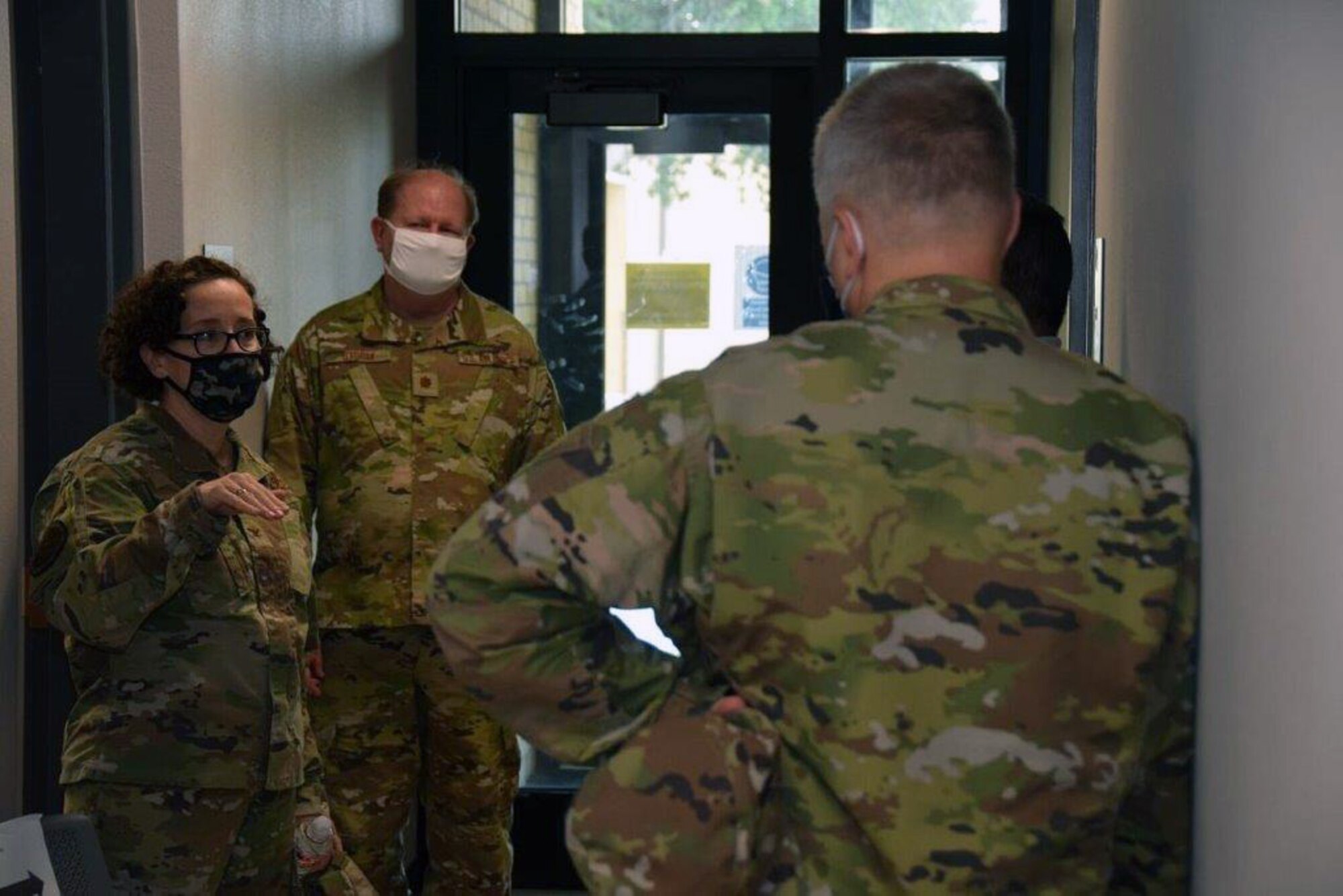 Col. Lisa M. Craig, Headquarters Air Force Reserve Command, A1 director of manpower, personnel and services, Robins Air Force Base, Georgia, talks with personnel during her return tour of building 817 here, June 18, 2020.