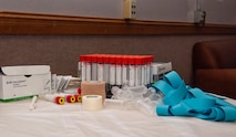 Medical supplies sit on table.