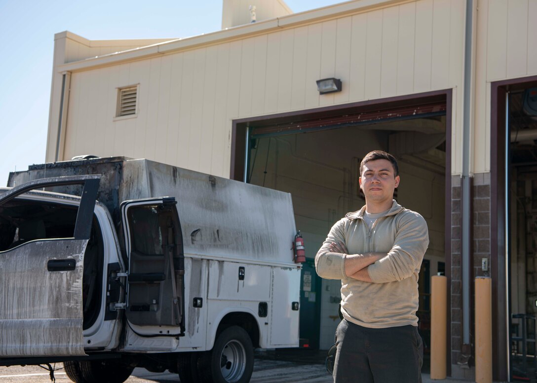 Senior Airman Joshua Meza, 90th Logistics Readiness Squadron, vehicle maintenance technician, stands next to a truck that he found with fire damage, June 23, 2020, on F.E. Warren Air Force Base, Wyoming. When Meza opened the door the fire seamed to all ready be out, and said the fire suppression system did its job well. (U.S. Air Force Photo by Senior Airman Braydon Williams)