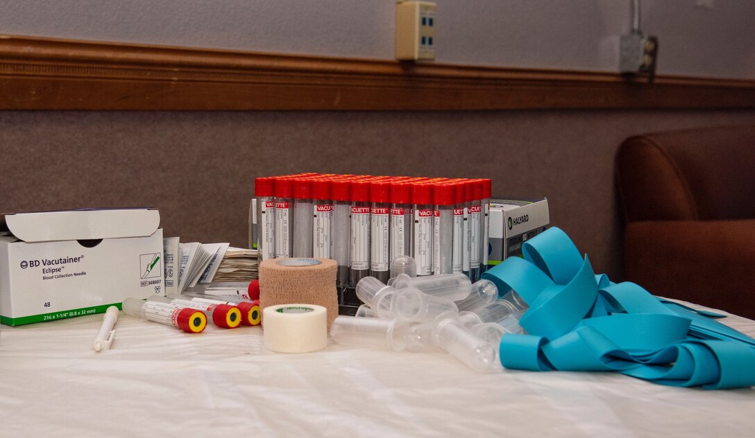 Medical supplies sit on table.