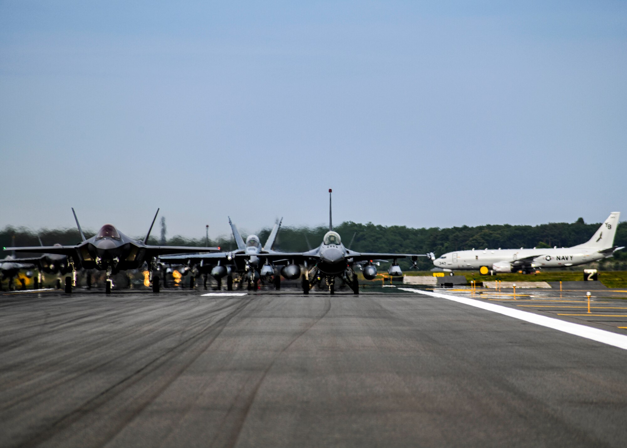Twelve U.S. Air Force F-16CM Fighting Falcons, 12 Koku-Jieitai F-35A Lightning II Joint Strike Fighters, two U.S. Navy EA-18G Growlers, a USN C-12 Huron, two USAF MC-130J Commando II aircraft, and a USN P-8 Poseidon participate in an "Elephant Walk" at Misawa Air Base, June 22, 2020. The Elephant Walk showcased Misawa Air Base's collective readiness and ability to generate combat airpower at a moment's notice to ensure regional stability throughout the Indo-Pacific. This is Misawa Air Base's first time hosting a bilateral and joint Elephant Walk.