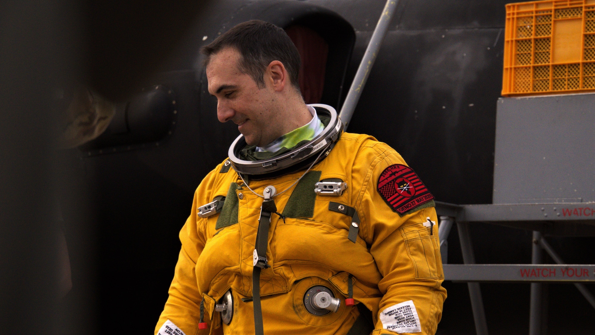 Lt. Col Georgescu smiles after receiving a Black Cat patch on his left shoulder that commemorates his 2,000th hour achievement.