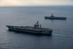 MEDITERRANEAN SEA (March 3, 2020) The aircraft carrier USS Dwight D. Eisenhower (CVN 69), left, and the French aircraft carrier FS Charles de Gaulle (R91) sail in formation. Ike is conducting operations in the Mediterranean Sea as part of the USS Dwight D. Eisenhower Carrier Strike Group.