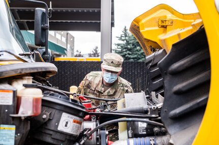 Oregon Army National Guard Soldiers check their trucks and load of personal protective equipment (PPE) before departing for deliveries throughout the state of Oregon. Approximately 200 Soldiers and Airmen were activated in the Oregon National Guard in response to various COVID-19 missions.