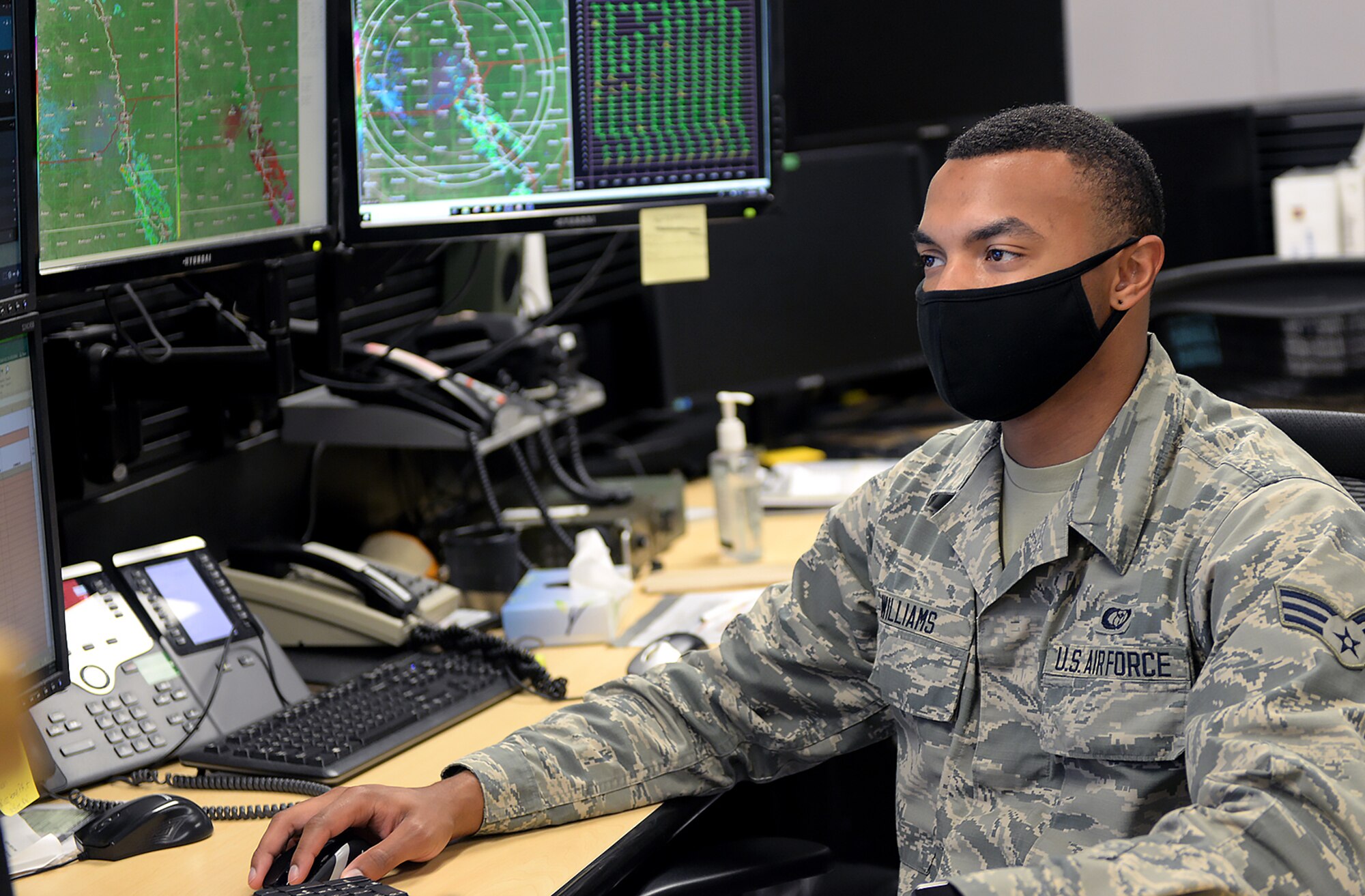 A photo of a weather forecaster taken for an Airfield operations story.