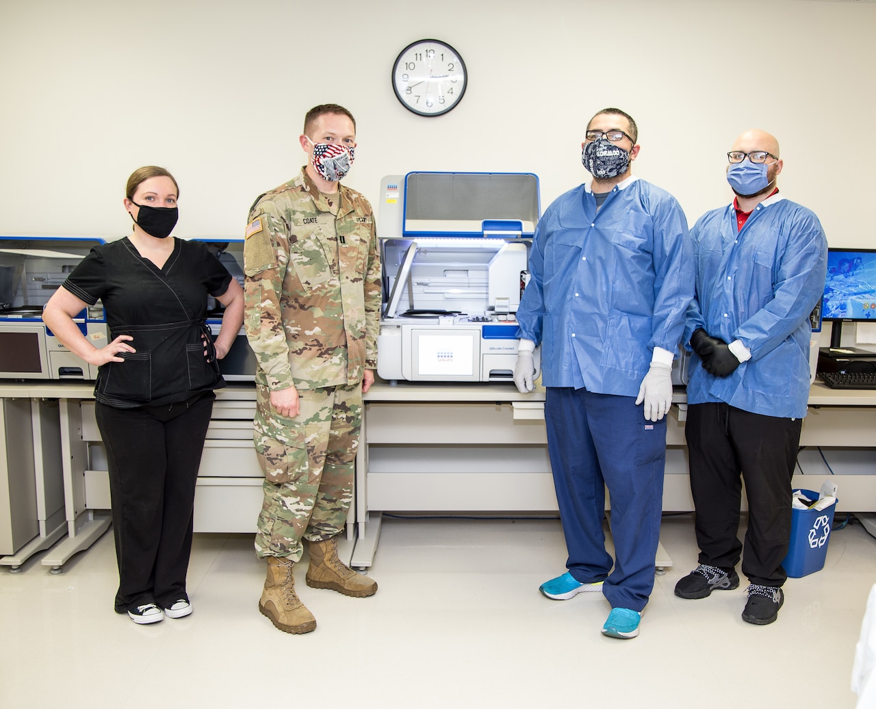 Molecular team members at Brooke Army Medical Center demonstrate molecular ribonucleic acid extraction equipment.