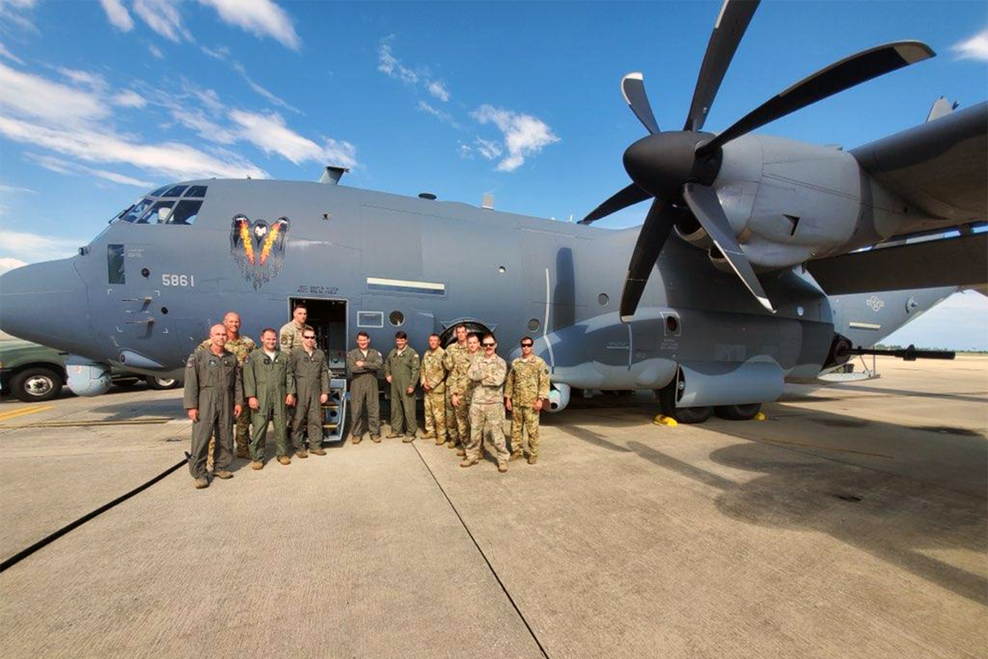 A group of 5th Special Operations Squadron Airmen pose in front of a AC-130J, June 5, 2020, Hurlburt Field, Fla.
