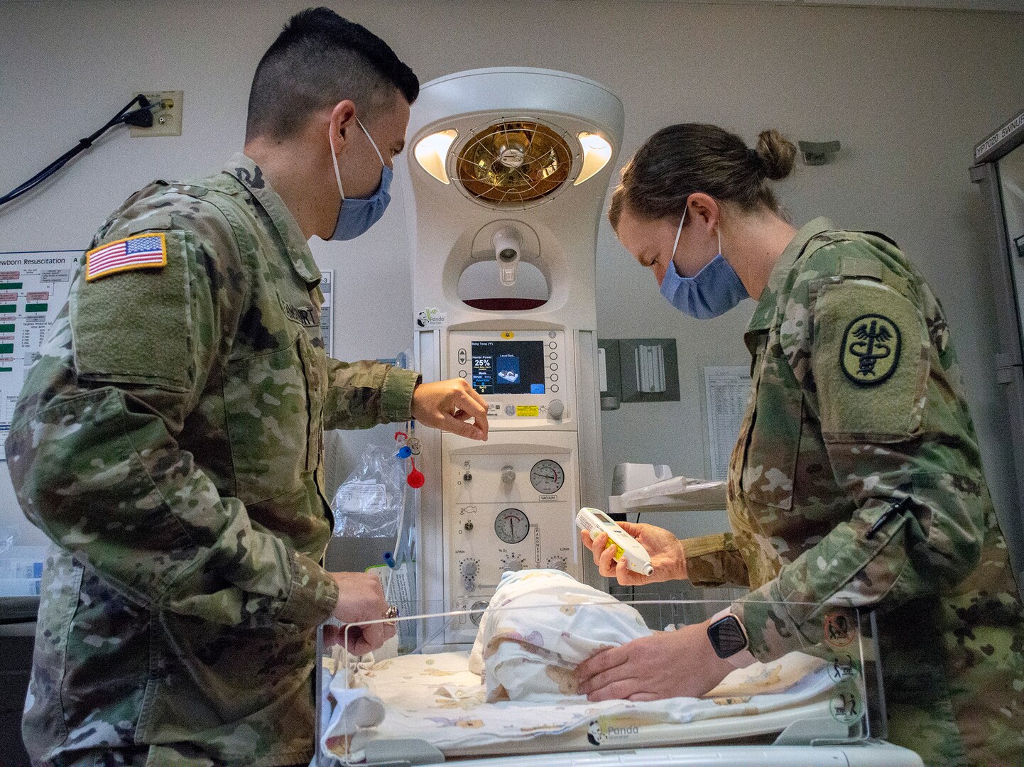 Doctors simulate checking on infant