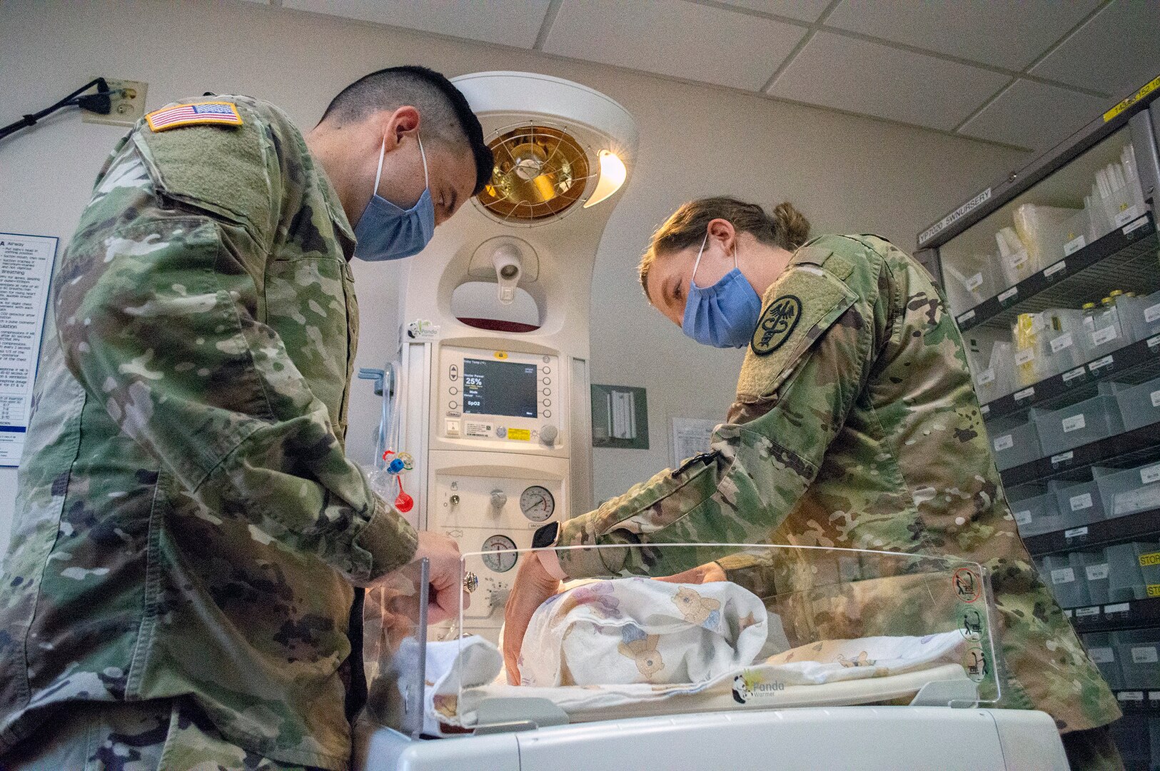 Doctors check infant