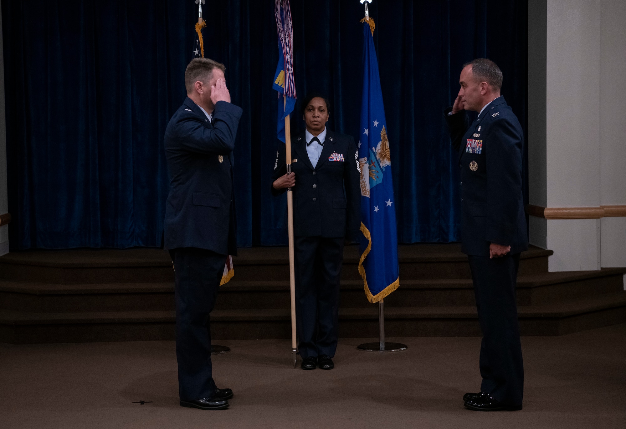 Colonel Peter Bonetti, 90th Missile Wing commander, salutes, Colonel Paul Toth, 90th Medical Group incoming commander, as he assumes command of the 90th MDG during a change of command ceremony June, 23, 2020, on F.E. Warren Air Force Base, Wyo. A change of command ceremony is a tradition that represents a formal transfer of authority and responsibility from the outgoing commander to the incoming commander. (U.S. Air Force photo by Senior Airman Abbigayle Williams)