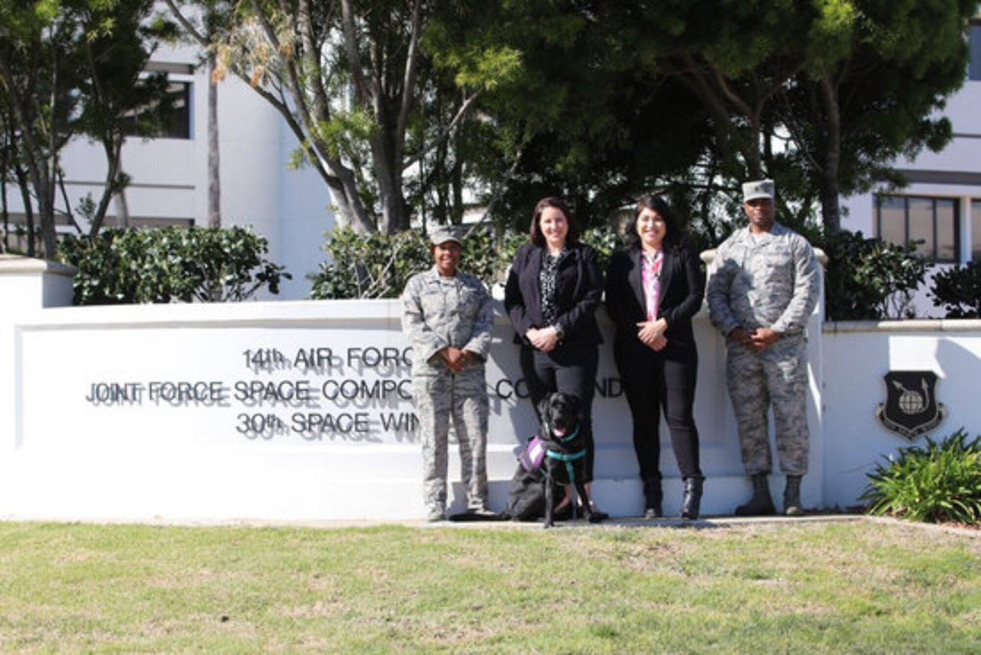 Members of the 30th Space Wing Sexual Assault Prevention and Response team pose for a photo Feb. 13, 2019, at Vandenberg Air Force Base, California. The 30th SAPR team is comprised of two coordinators, one lead victim advocate, and a courthouse facility dog along with 20 volunteer victim advocates. Their innovation and support led the SAPR team to win the 2019 Department of the Air Force Exceptional SAPR Team Award. (Courtesy photo)