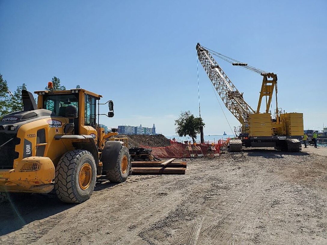 Construction is currently underway at the Chicago Harbor Lock’s North Pier. Repairs  will help stabilize the existing crib structure at the North Pier by driving roughly 500 feet of sheet pile on the lake side. The contract also includes installation of tie rods, removal and replacement of concrete slab, and excavation/fill of material. 
.