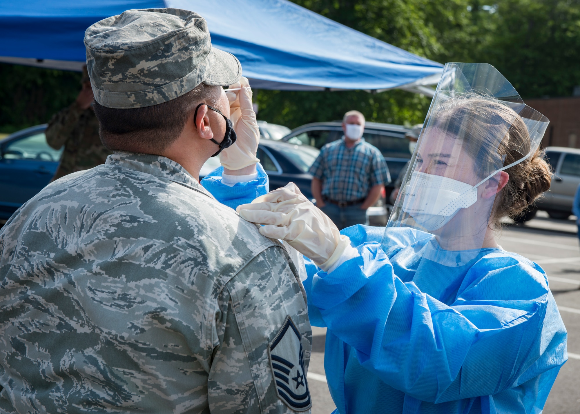 U.S. Air Force Staff Sgt. Carley Dolan, 103rd Medical Group aerospace medical technician, tests a 103rd Airlift Wing Airman for COVID-19 at Bradley Air National Guard Base, East Granby, Connecticut, June 19, 2020. The 103rd Medical Group worked in partnership with the Connecticut National Guard 14th Civil Support Team, New York National Guard 24th Civil Support Team, and Connecticut Department of Public Health to provide COVID-19 testing to Connecticut Air National Guard personnel. (U.S. Air National Guard photo by Staff Sgt. Steven Tucker)