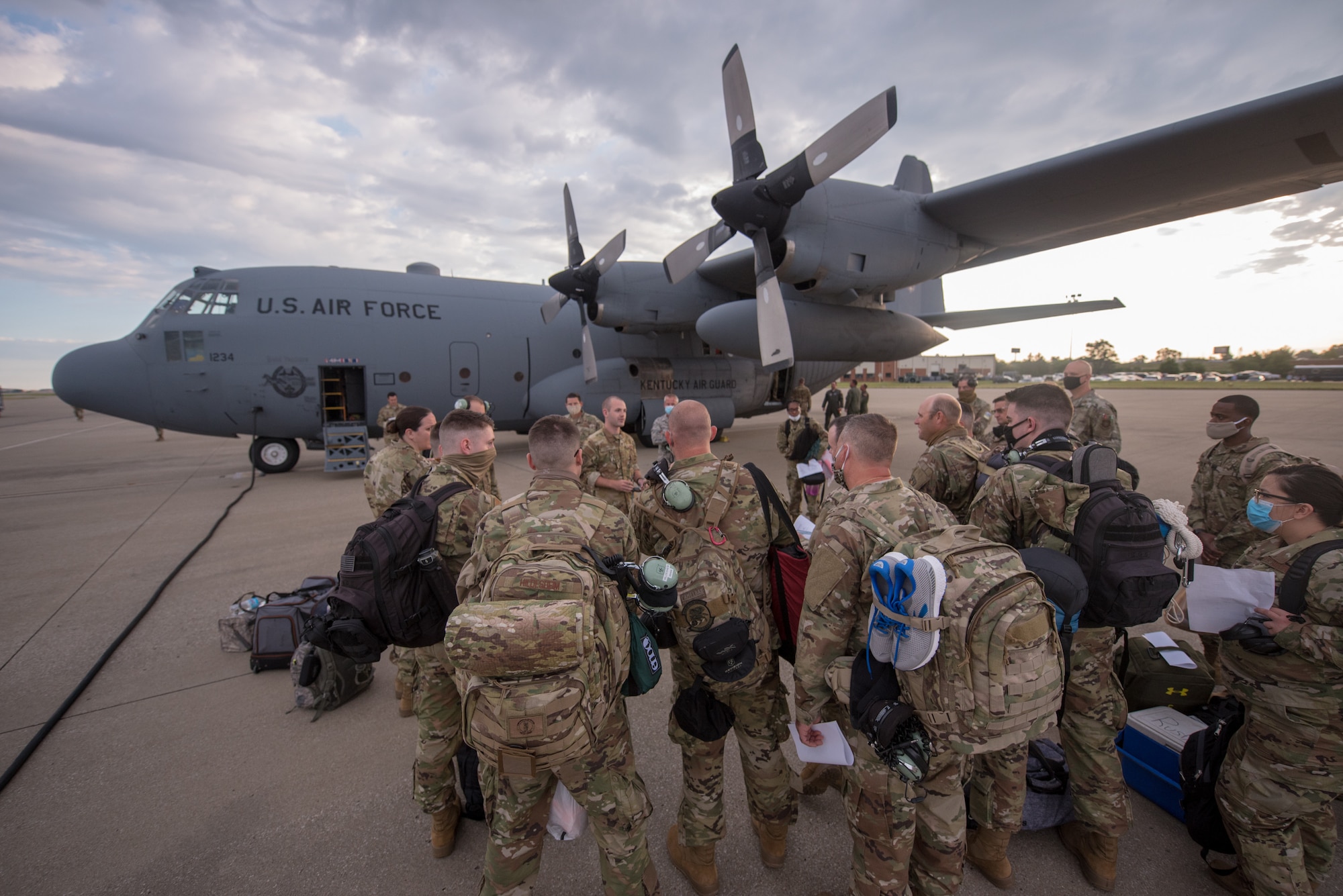 Members of the 123rd Airlift Wing board a C-130 Hercules aircraft at the Kentucky Air National Guard Base in Louisville, Ky., June 24, 2020, prior to deploying to the Persian Gulf region. The Airmen will spend four months flying troops and cargo across the U.S. Central Command area of responsibility, which includes Iraq, Afghanistan and northern Africa. (U.S. Air National Guard photo by Senior Airman Clayton Wear)