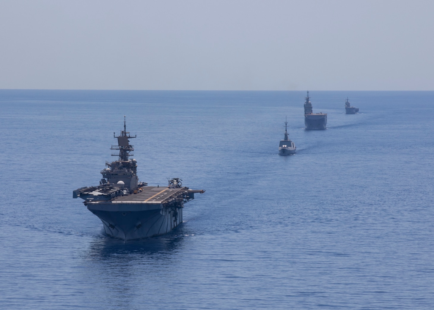 200624-N-KO533-2754
MEDITERRANEAN SEA (June 24, 2020) - From left to right, the Wasp-class amphibious assault ship USS Bataan (LHD 5), the French frigate FS Guepratte, the French amphibious assault ship FS Mistral and the Italian amphibious transport dock ship ITS San Giorgio sail in formation as part of a maritime training exercise, June 24, 2020. Bataan is conducting operations in U.S. 6th Fleet in support of regional allies and partners, and U.S. national security interests in Europe and Africa. (U.S. Navy photo by Mass Communication Specialist 3rd Class Lenny Weston/Released)