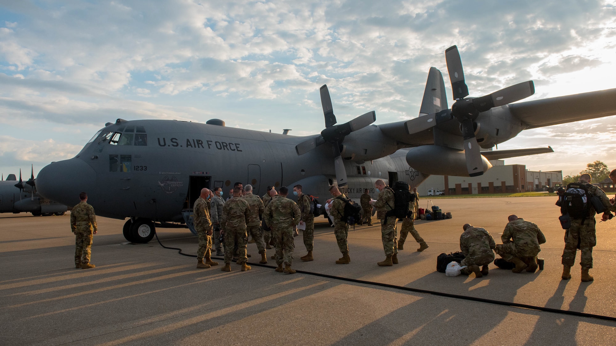 Members of the 123rd Airlift Wing board a C-130 Hercules aircraft at the Kentucky Air National Guard Base in Louisville, Ky., June 24, 2020, prior to deploying to the Persian Gulf region. The Airmen will spend four months flying troops and cargo across the U.S. Central Command area of responsibility, which includes Iraq, Afghanistan and northern Africa. (U.S. Air National Guard photo by Senior Airman Clayton Wear)