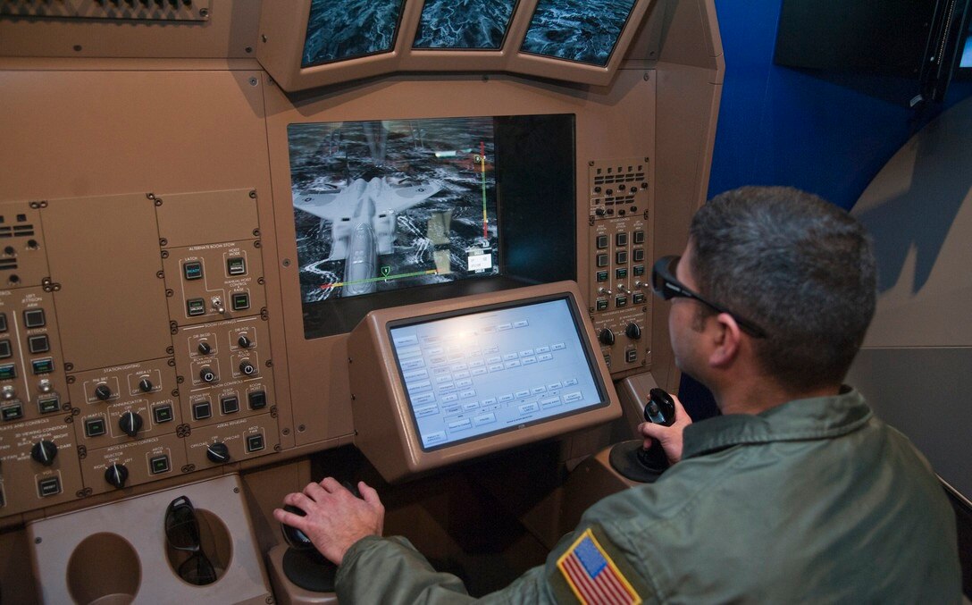 Master Sgt. Luis Rodriguez-Asad uses the KC-46A Remote Vision System demonstration Nov. 14, 2013, at McConnell Air Force Base, Kan. (U.S. Air Force photo/Airman 1st Class Colby L. Hardin)