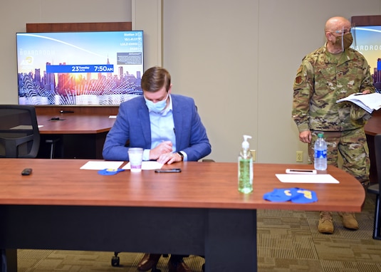 U.S. Air Force Col. Andres Nazario, 17th Training Wing commander, wears a face mask and a face shield while attending a community partnership briefing event at Angelo State University, in San Angelo, Texas, June 23, 2020. To combat COVID-19, ASU restricted the briefing room occupancy, required attendees to wear masks and sanitized the surfaces prior to the event. (U.S. Air Force photo by Airman 1st Class Abbey Rieves)