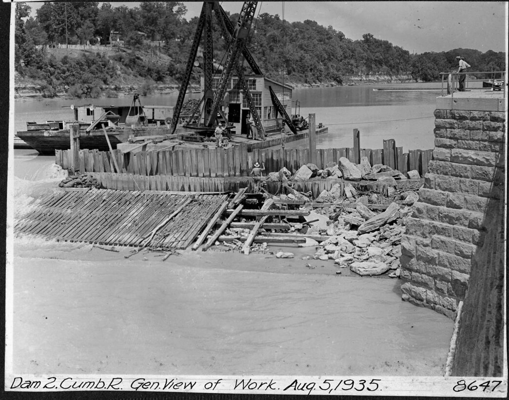 Repairs are underway at Lock and Dam 2 on the Cumberland River in Nashville, Tennessee, Aug. 5, 1935. The U.S. Army Corps of Engineers Nashville District built Lock and Dam 2 at this location to establish a navigation channel.  The structure was later replaced by today's modern dams. (USACE Photo)