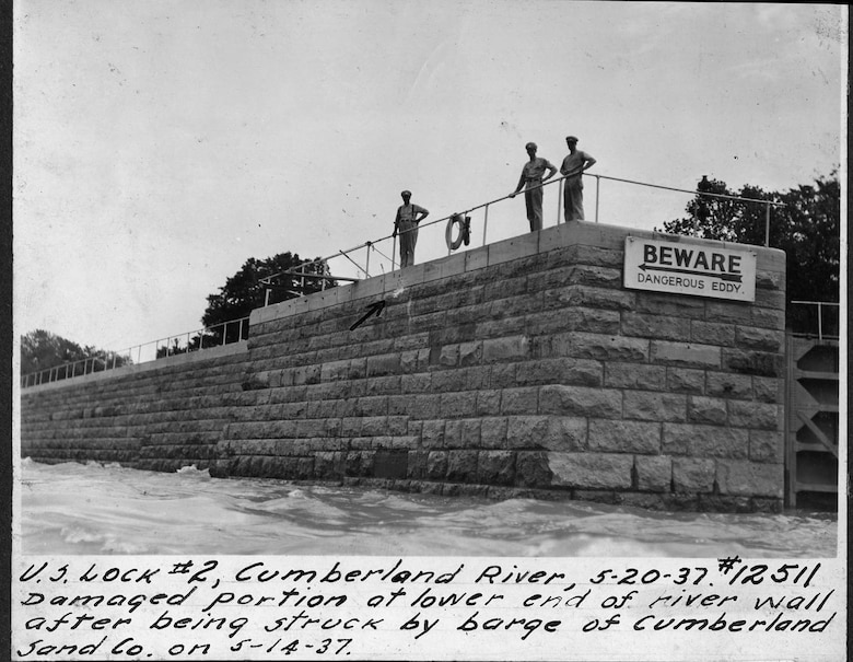 Operators show a damaged portion of the lower end of the river wall at Lock 2 on the Cumberland River in Nashville, Tennessee, May 20, 1937. The U.S. Army Corps of Engineers Nashville District built Lock and Dam 2 at this location to establish a navigation channel.  The structure was later replaced by today's modern dams. (USACE Photo)