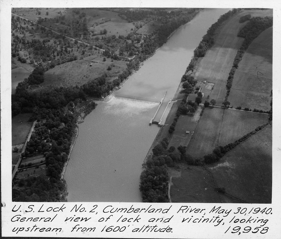 This is an aerial view from an altitude of 1,600 feet of Lock 2 on the Cumberland River in Nashville, Tennessee, May 30, 1940. The general view is seen looking upstream. The U.S. Army Corps of Engineers Nashville District built Lock and Dam 2 at this location to establish a navigation channel.  The structure was later replaced by today's modern dams. (USACE Photo)