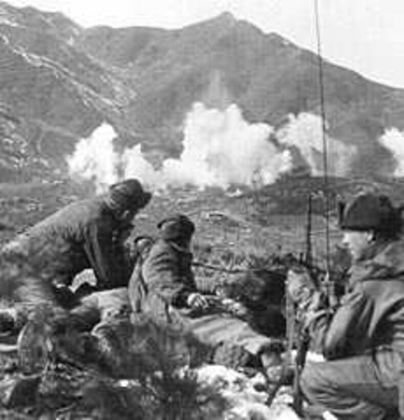 Soldiers call artillery fire onto enemy position.