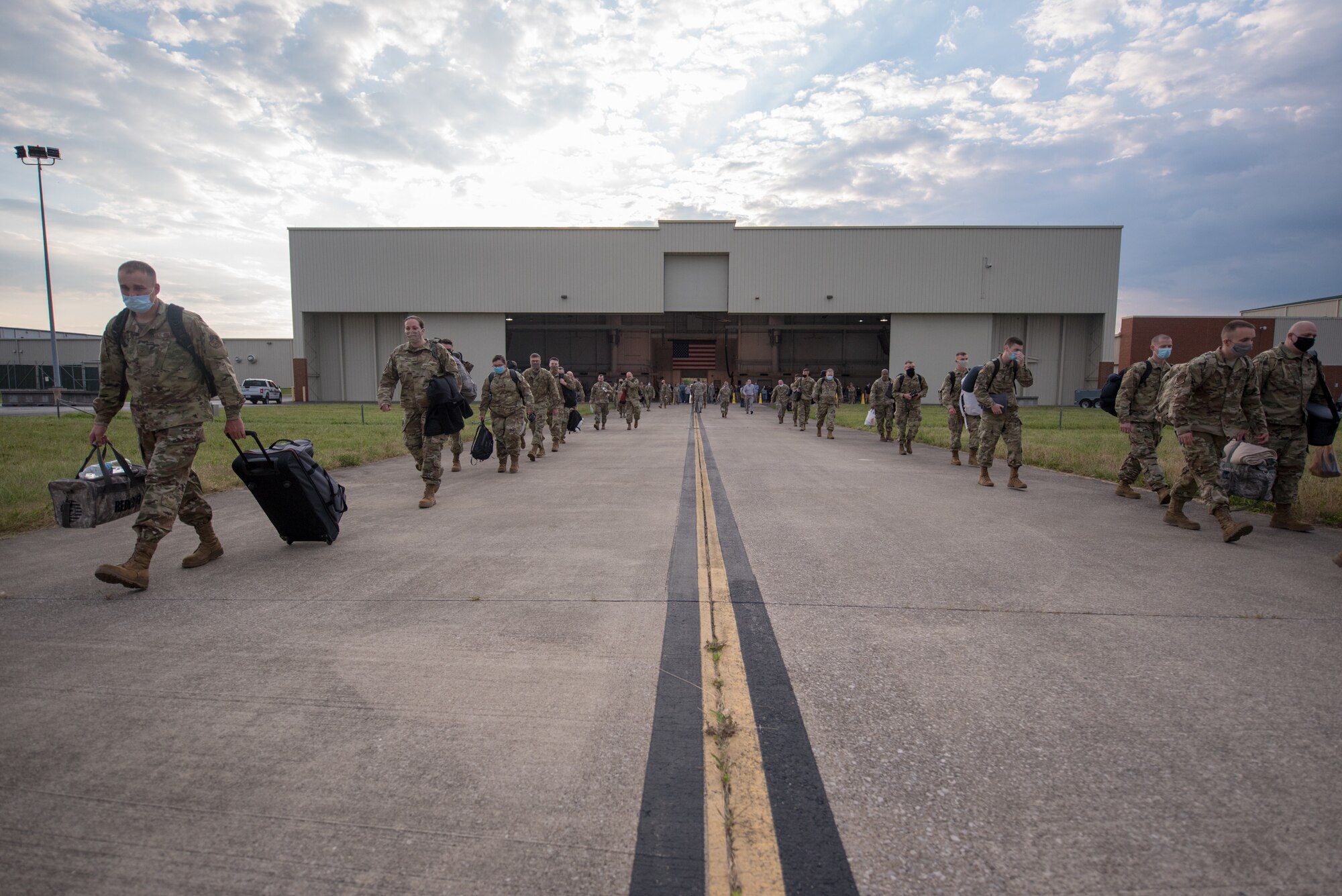 Members of the 123rd Airlift Wing board a C-130 Hercules aircraft at the Kentucky Air National Guard Base in Louisville, Ky., June 24, 2020, prior to deploying to the Persian Gulf region. The Airmen will spend four months flying troops and cargo across the U.S. Central Command area of responsibility, which includes Iraq, Afghanistan and northern Africa. (U.S. Air National Guard photo by Senior Airman Clayton Wear)