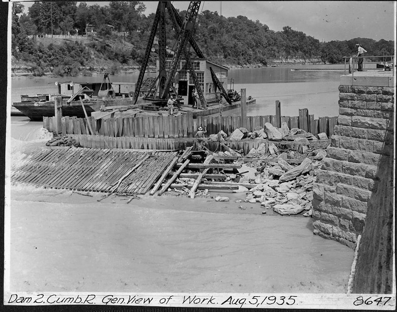 Repairs are underway at Lock and Dam 2 on the Cumberland River in Nashville, Tennessee, Aug. 5, 1935. The U.S. Army Corps of Engineers Nashville District built Lock and Dam 2 at this location to establish a navigation channel.  The structure was later replaced by today's modern dams. (USACE Photo)