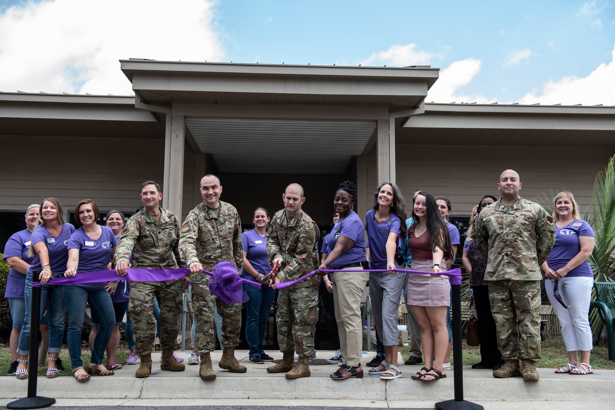 Image of a ribbon cutting ceremony for the new Youth Center.